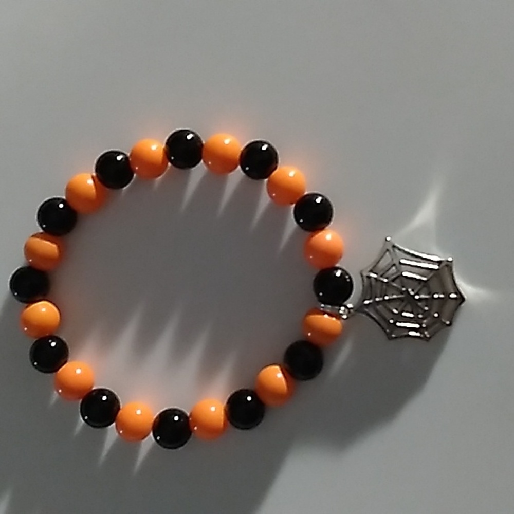 Orange & Black stretch bracelet with spider web charm